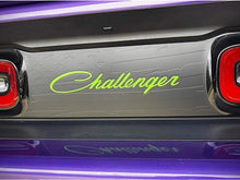 Load image into Gallery viewer, Customizable Dodge Challenger taillight divider decal with neon green Challenger logo, surrounded by purple accent lighting, showcasing sleek design and personalization options for car enthusiasts.