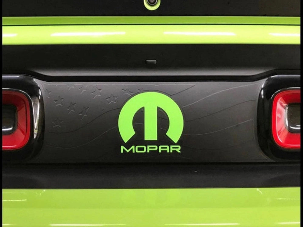 Challenger taillight divider decal with bright green MOPAR logo and accents, showcasing customizable design on black background between red taillights