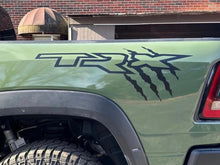 Load image into Gallery viewer, Ram TRX bedside decal with claw marks on green truck body, showcasing custom vinyl graphics for RAM pickup truck exterior customization