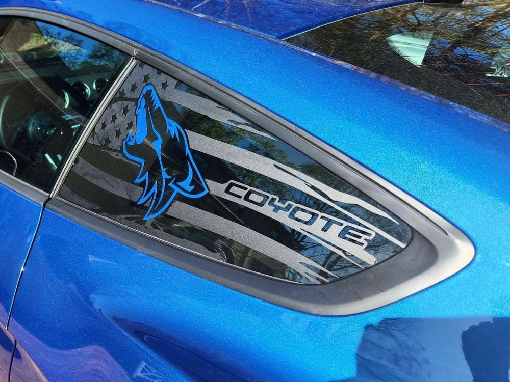 Blue Ford Mustang with custom quarter window decal featuring black flag design and blue Coyote logo, showcasing the S550 Mustang Quarter Window Decals product