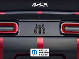 Dodge Challenger taillight divider with MOPAR Devil logo decal, showcasing customizable design options between red taillights on dark vehicle rear