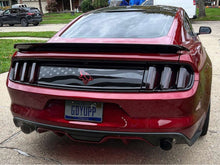 Load image into Gallery viewer, Rear view of a red Ford Mustang S550 with custom decklid decal featuring American flag design and Coyote logo, showcasing the product on a residential driveway