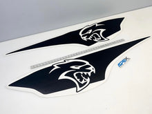 Load image into Gallery viewer, RAM TRX Ignition Style Bedside Decals featuring Hellcat logo, shown as two large black vinyl stickers with white fierce cat head design, displayed alongside a measuring ruler for size reference