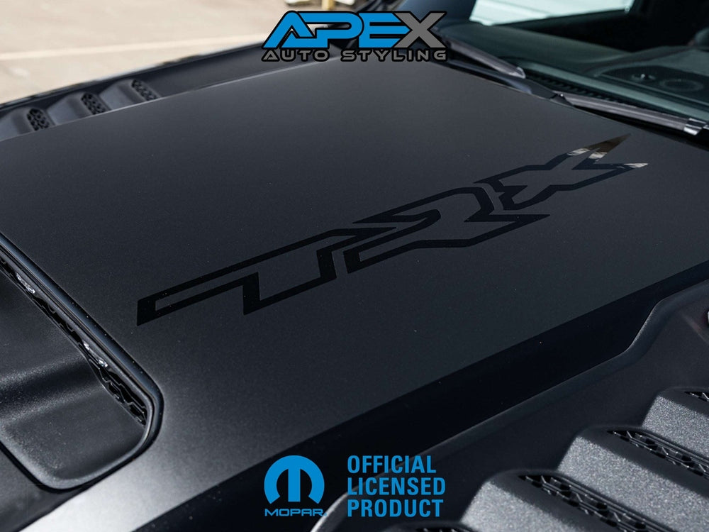 RAM TRX hood decal set featuring OEM-style matte black graphics with TRX logo cutout. Includes main decal and front scoop decal for authentic factory appearance on truck hood. Premium outdoor vinyl material ensures durability and precise fitment.