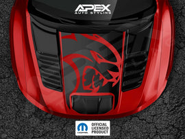 Red RAM TRX truck hood with large black cutout featuring red Hellcat logo decal, showcasing Apex Auto Styling product on glossy surface with air vents and official licensed product badge