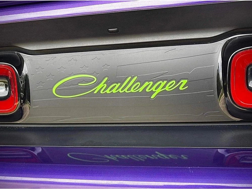 Customizable Dodge Challenger taillight divider decal with neon green Challenger logo, surrounded by purple accent lighting, showcasing sleek design and personalization options for car enthusiasts.
