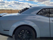 Load image into Gallery viewer, Silver Dodge Challenger with honeycomb pattern quarter window decal, parked on open road under cloudy sky, showcasing sleek design and custom appearance
