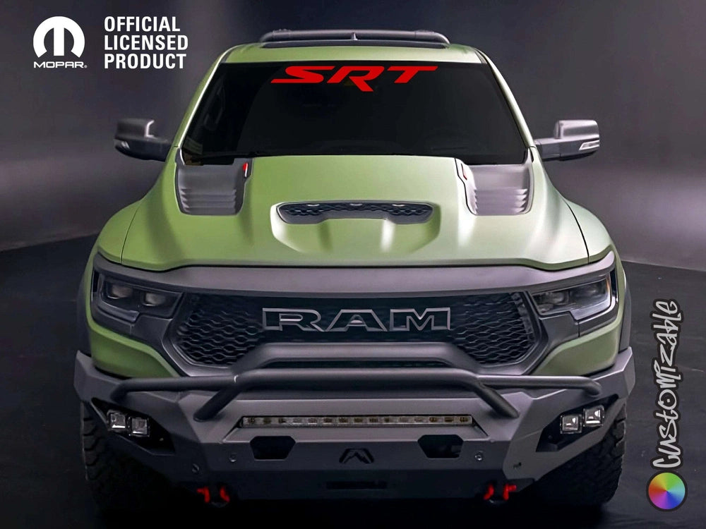 Green RAM truck with SRT logo windshield banner, aggressive front grille, and rugged off-road bumper, showcasing customized decal and performance styling for RAM and TRX models