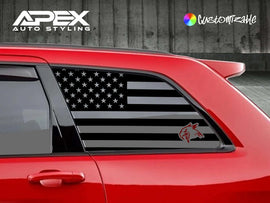 Red Jeep Grand Cherokee with black American flag and hawk logo quarter window decal, showcasing custom styling for 2011-2021 models