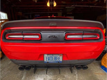 Load image into Gallery viewer, Rear view of a red Dodge Challenger SRT with customized taillights, displaying a &#39;392&#39; badge and &#39;EVILBEE&#39; license plate, showcasing the taillight divider decal product in a garage setting.