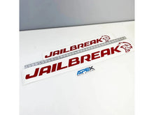 Load image into Gallery viewer, Jailbreak logo windshield banner decals in red with cat icon, displayed next to measuring ruler. Custom vinyl stickers for Charger and Challenger vehicles.