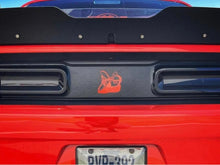 Load image into Gallery viewer, Red Dodge Challenger rear view showing taillight area with black divider featuring orange Scat Pack logo decal, customized appearance for 2015+ models