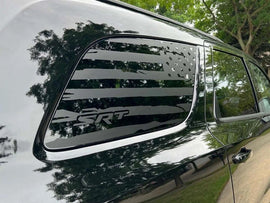 Dodge Durango quarter window with black SRT logo decal featuring American flag design, showcasing custom styling and premium vinyl application on vehicle's side panel