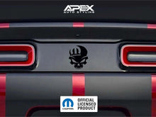 Load image into Gallery viewer, Dodge Challenger taillight divider with black MOPAR skull logo decal, showcasing customizable design options for car enthusiasts. Red taillights and rear bumper visible.