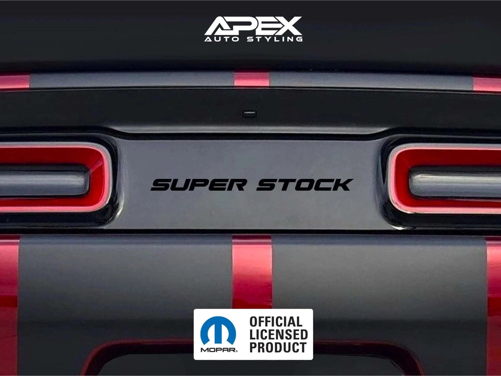 Close-up of a Dodge Challenger rear with customized taillight divider decal featuring "SUPER STOCK" text, Apex Auto Styling logo, and Mopar official licensed product emblem. Red and black color scheme visible on the car's exterior.