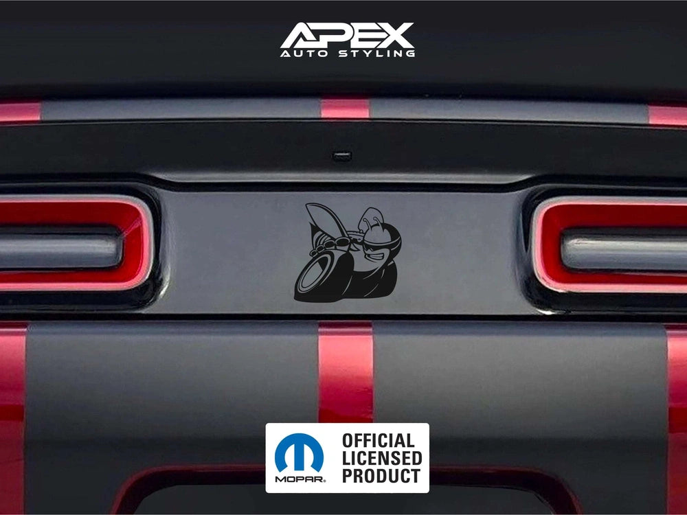Dodge Challenger taillight divider with custom Scat Pack logo decal installed, showcasing sleek black design between red taillights on gray and red striped rear bumper. APEX Auto Styling and Mopar logos visible.