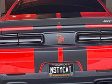 Load image into Gallery viewer, Red Dodge Challenger rear view with black taillight divider decal featuring orange Hellcat logo. Custom license plate reads &quot;NSTYCAT&quot; with Hellcat branding. Red and black striped design on trunk and lower body.