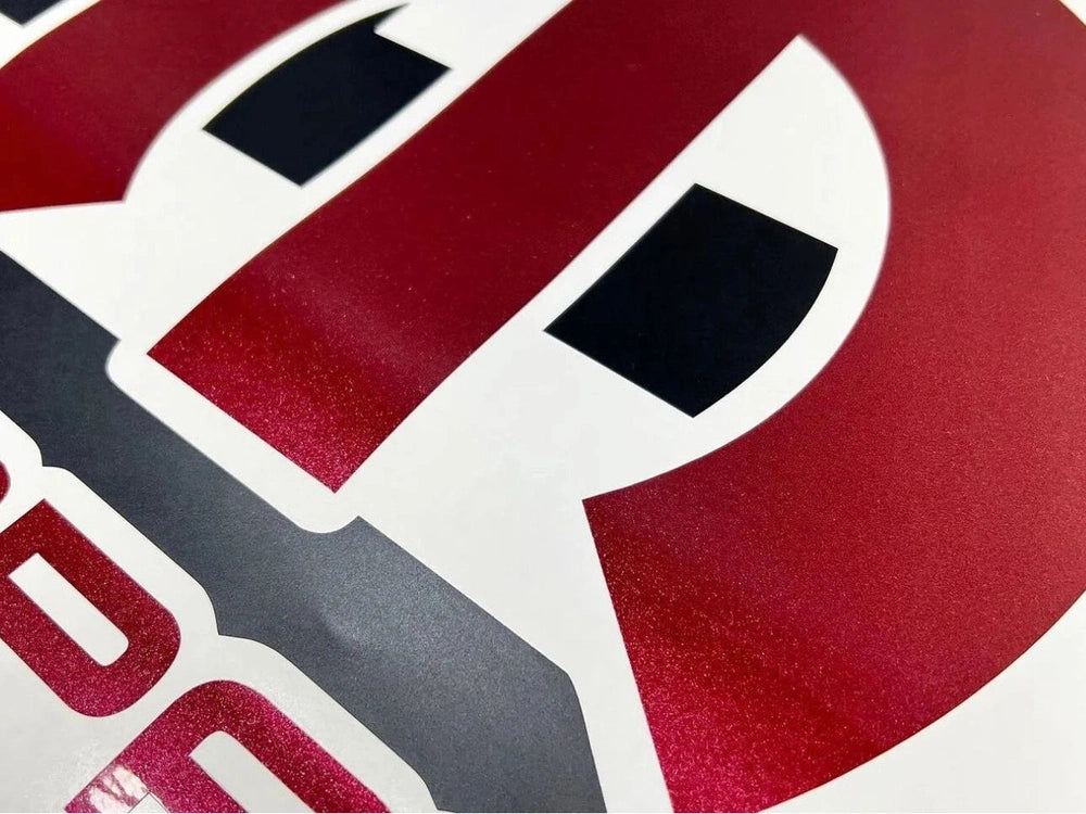 Close-up of a red and white Dodge Challenger sunroof decal featuring the MOPAR logo. The image showcases the high-quality vinyl material and precision-cut design, highlighting the product's durability and custom fit for 2008+ Challengers.