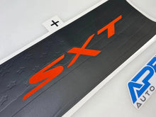 Load image into Gallery viewer, Customizable Challenger taillight divider decal with SXT logo in orange on black background, featuring star pattern. Protective vinyl accessory for car styling.