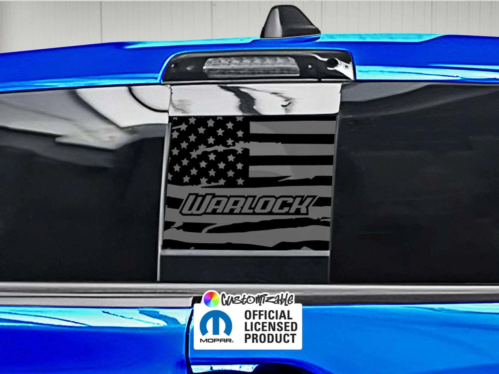 Custom RAM truck rear sliding window decal featuring Warlock logo and American flag design, shown on blue vehicle with official licensed product badge