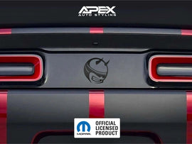 Dodge Challenger taillight divider with Demon Bee Logo decal, showcasing Apex Auto Styling customization. Red and black color scheme visible on rear of vehicle. Official licensed product badge displayed.