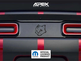 Dodge Challenger taillight divider with Hellkitten logo decal, showcasing customizable vinyl design by Apex Auto Styling. Red taillights visible on black vehicle rear, with official Mopar licensed product badge.