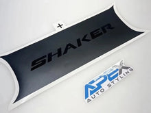 Load image into Gallery viewer, Challenger taillight divider decal with Shaker logo in black, showcasing sleek design and custom styling for Dodge Challenger. APS Auto Styling logo visible, indicating product brand.