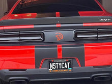 Load image into Gallery viewer, Red Dodge Challenger rear view showing custom taillight divider decal with Hellcat logo and SRT badge, featuring black racing stripes and a personalized license plate reading &quot;N5TYCAT