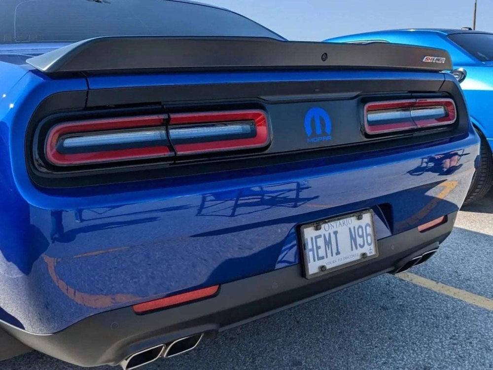 Blue Dodge Challenger rear view showing taillight divider decal with MOPAR logo, highlighting customizable design options for personalized appearance