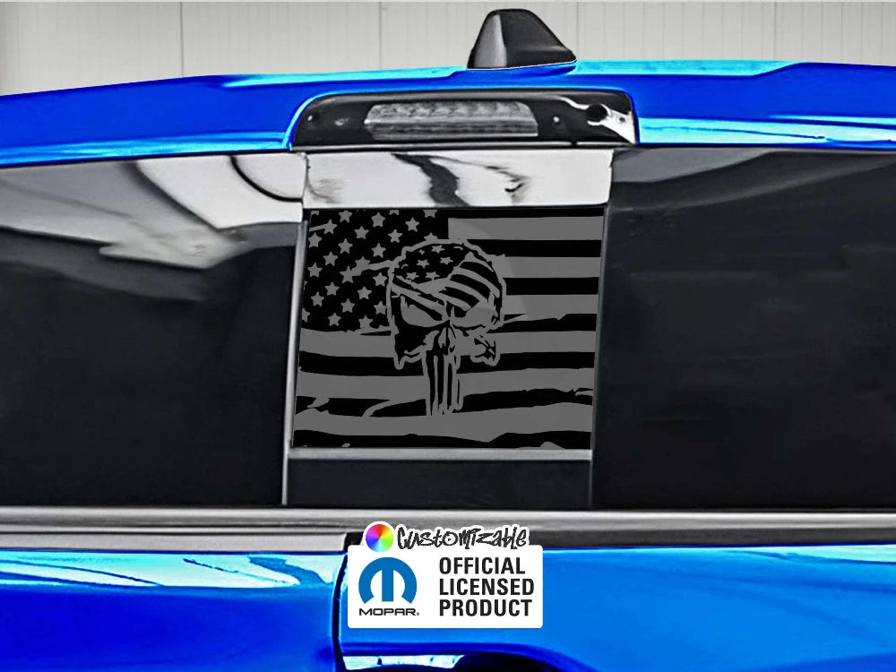 Custom RAM truck rear sliding window decal featuring Punisher skull on American flag design, shown on blue vehicle with official licensed product sticker