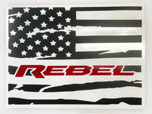 Load image into Gallery viewer, Distressed American flag decal with black and white design featuring &quot;REBEL&quot; text in red, customized for RAM truck rear sliding window, showcasing patriotic style and brand loyalty