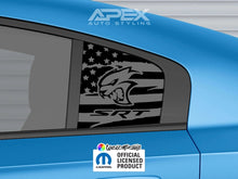 Load image into Gallery viewer, Dodge Charger quarter window decal featuring SRT Hellcat logo and American flag design on matte black background, displayed on blue car with Apex Auto Styling branding
