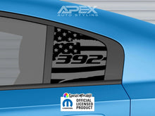 Load image into Gallery viewer, Dodge Charger quarter window decal featuring 392 logo and American flag design on matte black background, shown on blue car body with Apex Auto Styling branding