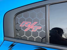 Load image into Gallery viewer, Dodge Charger quarter window decal with hexagonal pattern and red R/T logo, showcasing custom vinyl design for 2011-2023 models against blue sky background