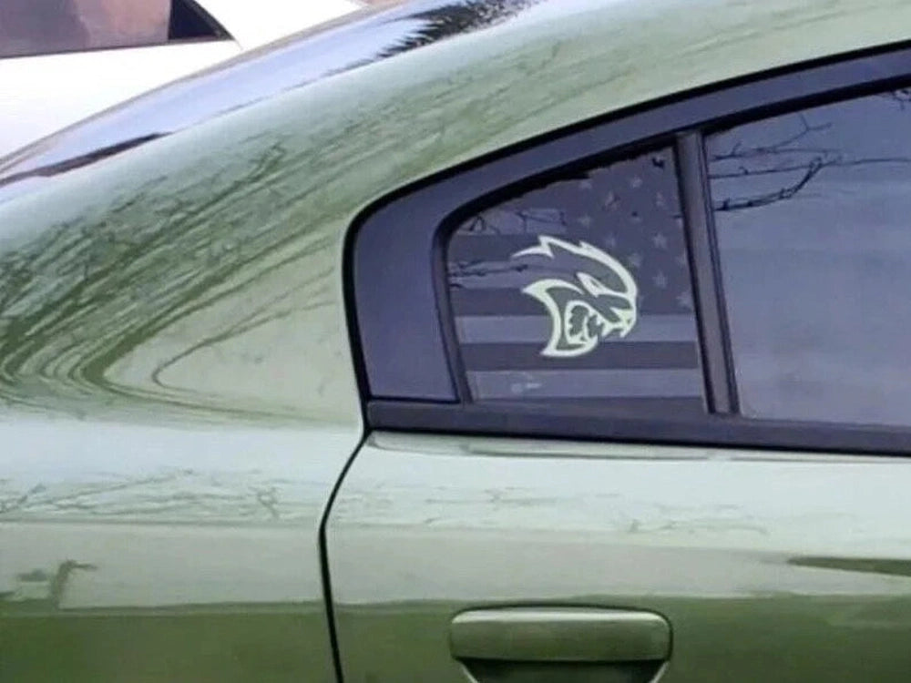 Green Dodge Charger with Hellcat logo decal on quarter window, showcasing custom vinyl application for 2011-2023 models