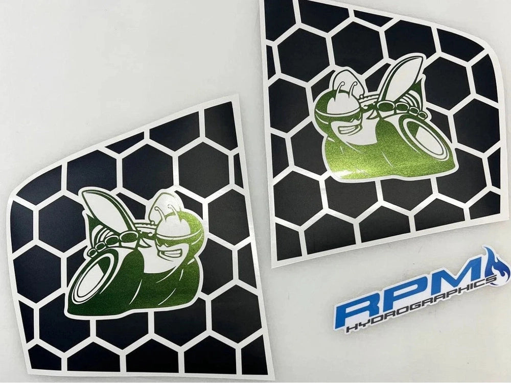 Dodge Charger quarter window decals featuring Scat Pack bee logo in green on black honeycomb pattern background, with RPM Hydrographics branding visible