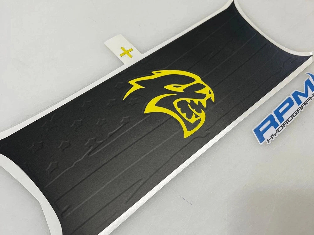 Challenger taillight divider decal with yellow Hellcat logo on black background, showcasing customizable design options for Dodge Challenger owners