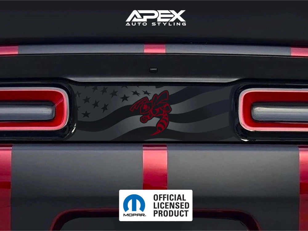 Dodge Challenger taillight divider decal featuring American flag design and red angry hornet logo, installed between taillights on black vehicle rear with APEX Auto Styling branding visible