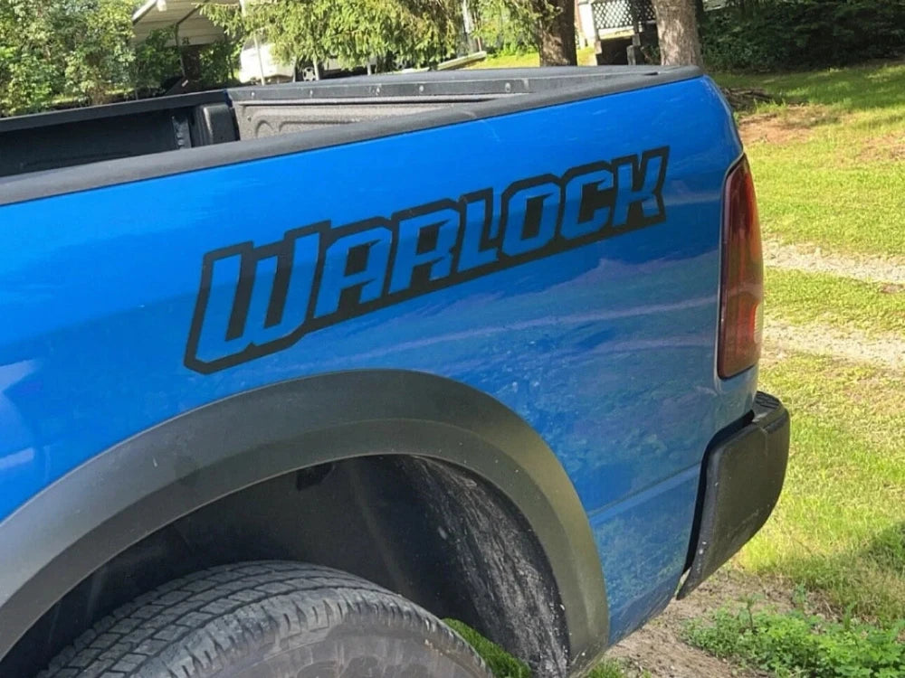 Hydro Blue Ram Warlock with matte black bed decals from Apex Auto Styling
