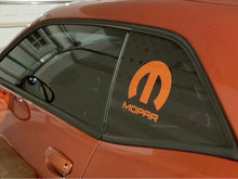 Load image into Gallery viewer, Orange Dodge Challenger with custom MOPAR logo decal on quarter window, showcasing sleek design and brand loyalty for automotive enthusiasts