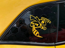 Load image into Gallery viewer, Yellow Dodge Challenger quarter window with Angry Hornet logo decal in matching color, showcasing custom vinyl design on honeycomb patterned background