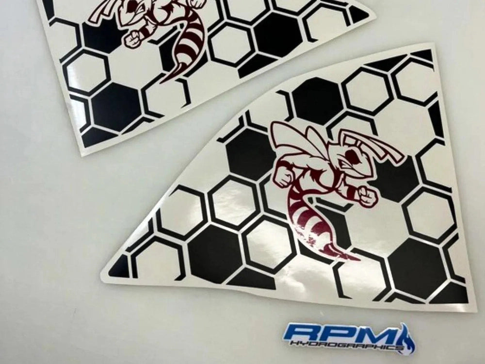 Challenger quarter window decals featuring angry hornet logo on honeycomb background. Two triangular vinyl stickers shown, one with red hornet and one with white, both on black and white hexagonal pattern.