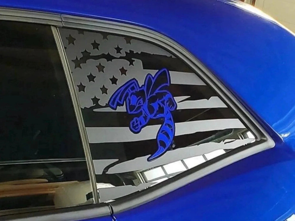 Challenger quarter window decal featuring American flag design with stars and stripes, overlaid with blue angry hornet logo, applied to bright blue car exterior