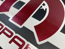 Load image into Gallery viewer, Close-up of MOPAR logo decal for Dodge Challenger quarter window, featuring metallic red and black colors on white background, showcasing premium vinyl quality and precise design for custom automotive styling