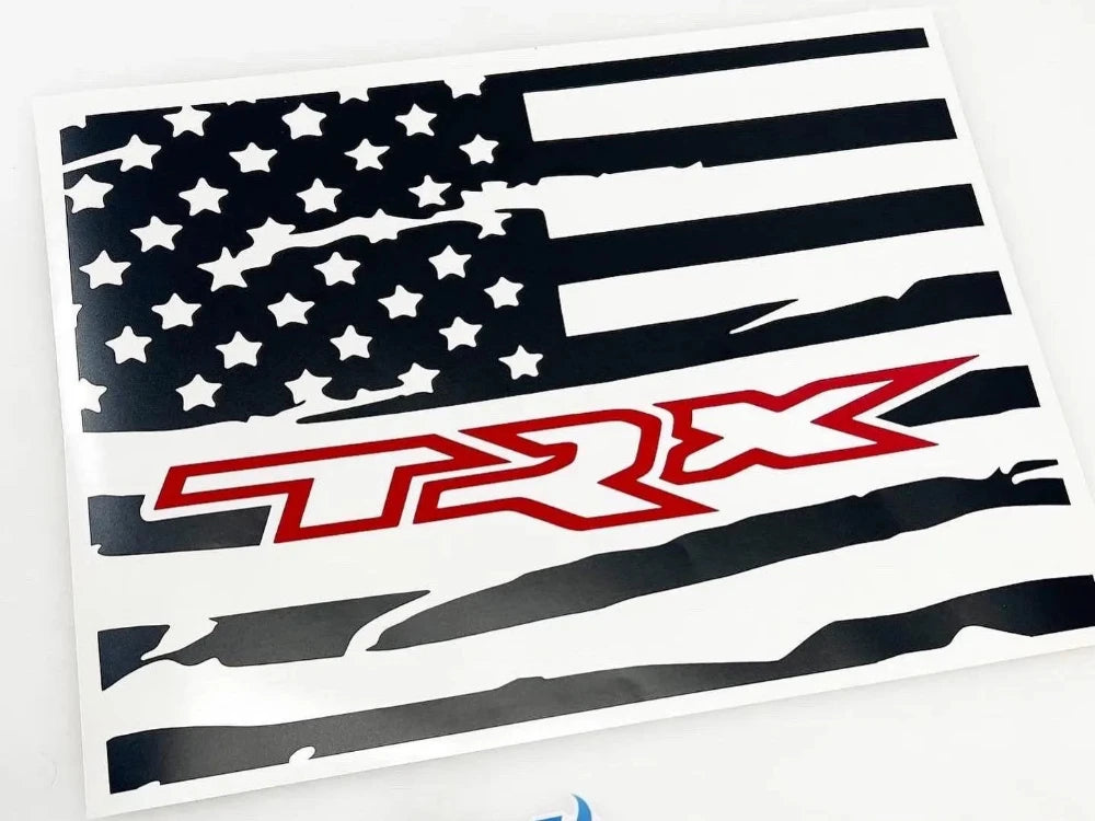 Custom rear sliding window decal for RAM trucks featuring a black and white American flag design with red TRX logo, showcasing patriotic style and brand loyalty for 2009+ RAM pickup owners