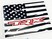Load image into Gallery viewer, Custom rear sliding window decal for RAM trucks featuring a black and white American flag design with red TRX logo, showcasing patriotic style and brand loyalty for 2009+ RAM pickup owners