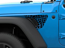 Closeup of blue Jeep Wrangler or Gladiator fender with alligator scales decal applied, showcasing custom look and precise fitment of black vinyl accessory on vehicle's side vent