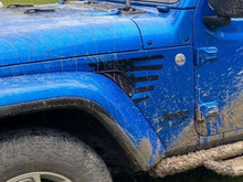 Load image into Gallery viewer, Blue Jeep Wrangler fender vent with black decal stripe design, showcasing customizable fender vent area for American flag decals, muddy tires indicating off-road use
