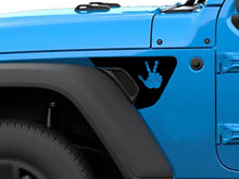 Load image into Gallery viewer, Blue Jeep Wrangler fender with custom peace sign decal in contrasting color, showcasing the product&#39;s appearance on a vehicle and demonstrating its precise fit and unique design for Jeep enthusiasts.