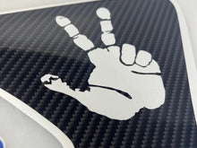 Load image into Gallery viewer, Peace sign decal for Jeep Wrangler and Gladiator fender vents, featuring a white hand gesture on black carbon fiber background, precision cut for perfect fitment on 2018-2022 models